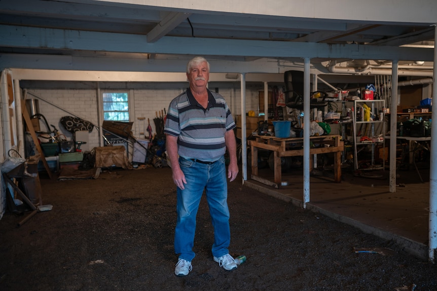 A man stands in a basement