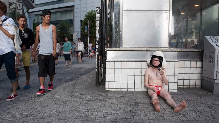 David Elliot-Jones dressed in character on the street in Big In Japan.