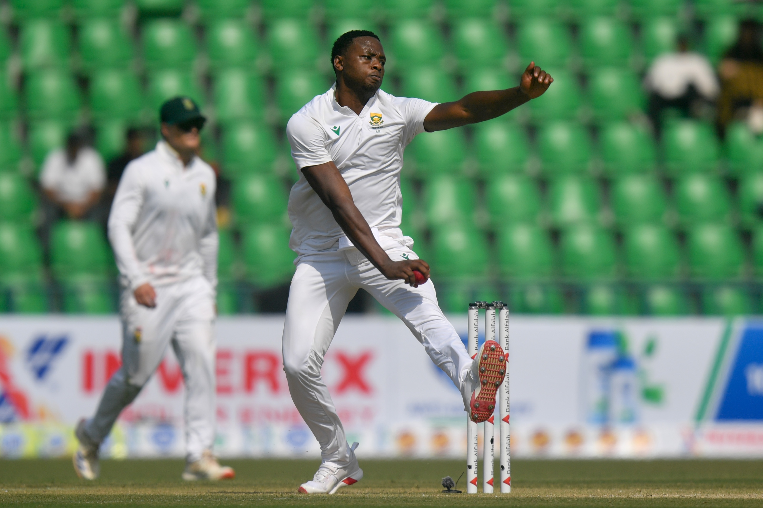 A South African Test pace bowler gets into his delivery stride to bowl a ball during a game.