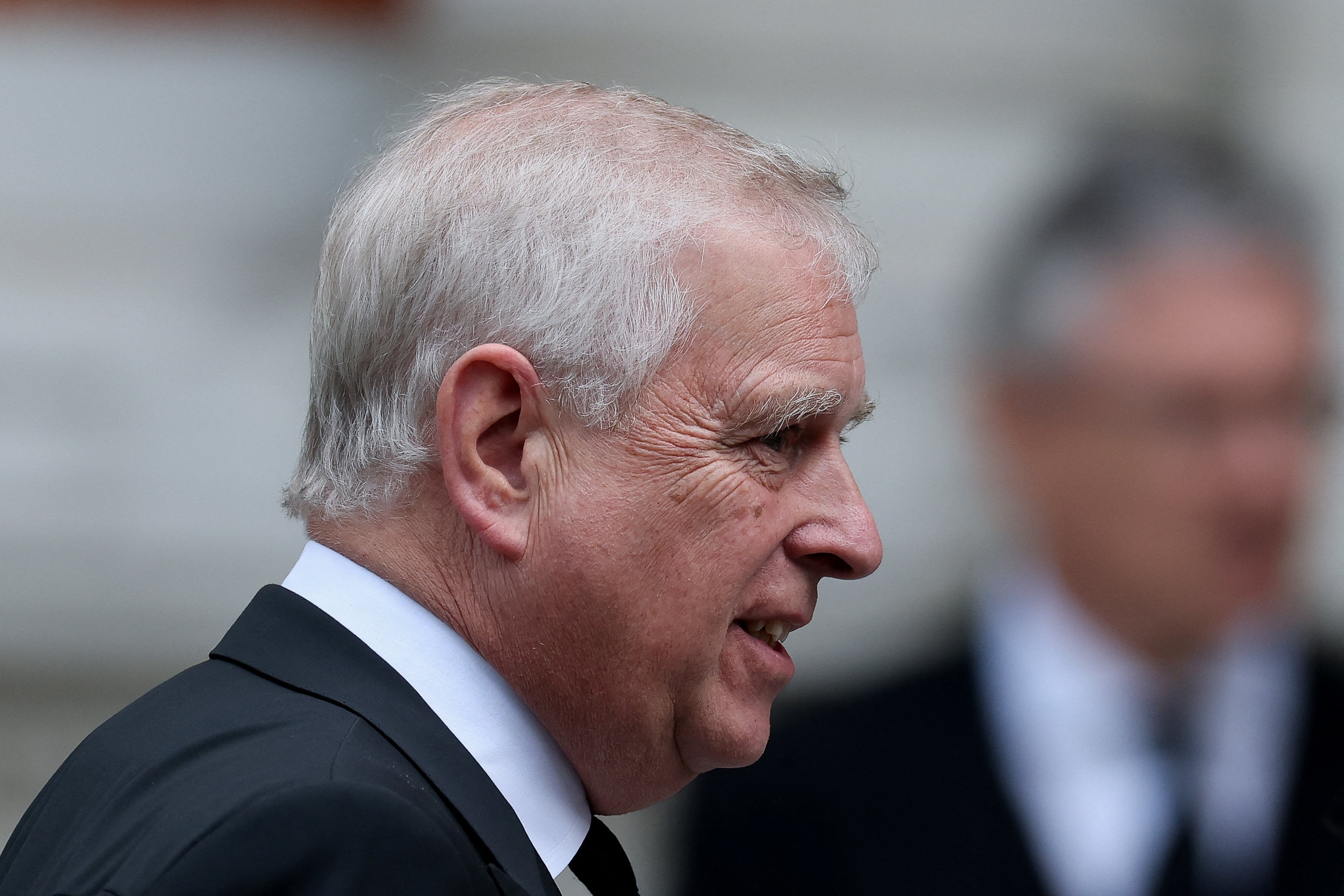 A close up of Prince Andrew's face from the side