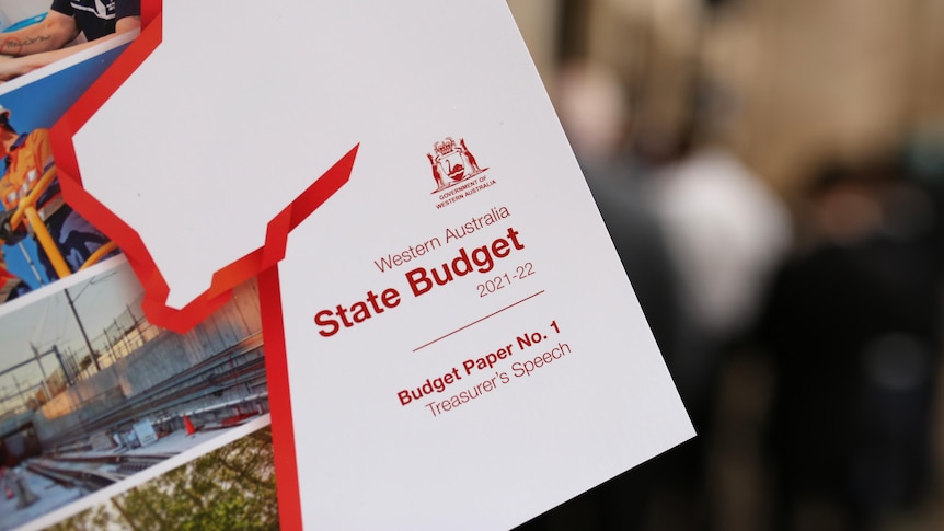A close-up of a WA Budget paper with a red outline of the state.