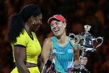 All smiles ... Angelique Kerber (R) poses with the Daphne Akhurst Memorial Cup alongside Serena Williams