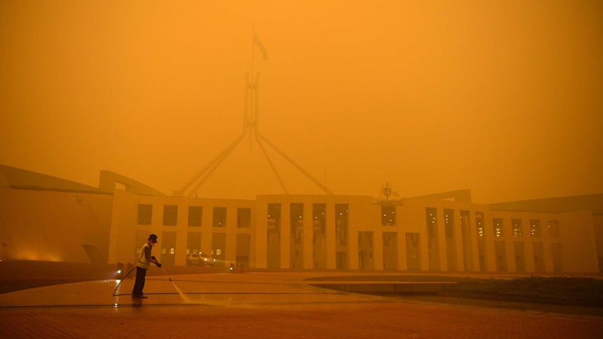 Orange haze obscures Parliament House.
