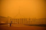 Orange haze obscures Parliament House.