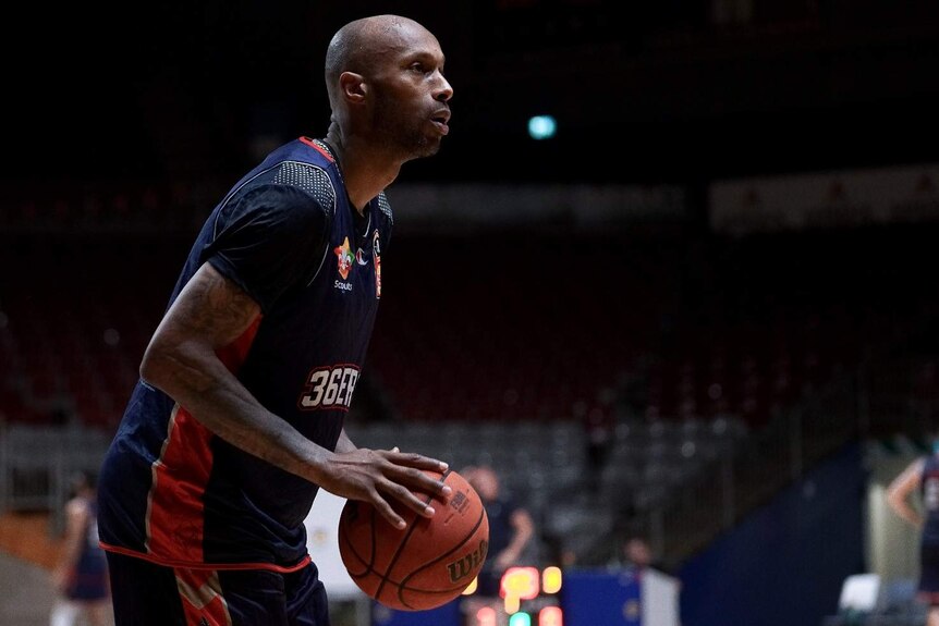 Basketballer Tony Crocker prepares to shoot.