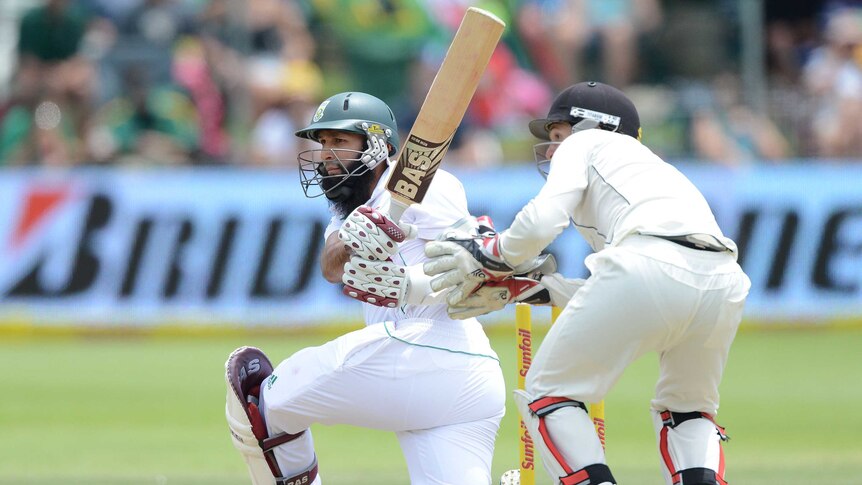 South Africa's Hashim Amla sweeps a delivery against New Zealand in Port Elizabeth.