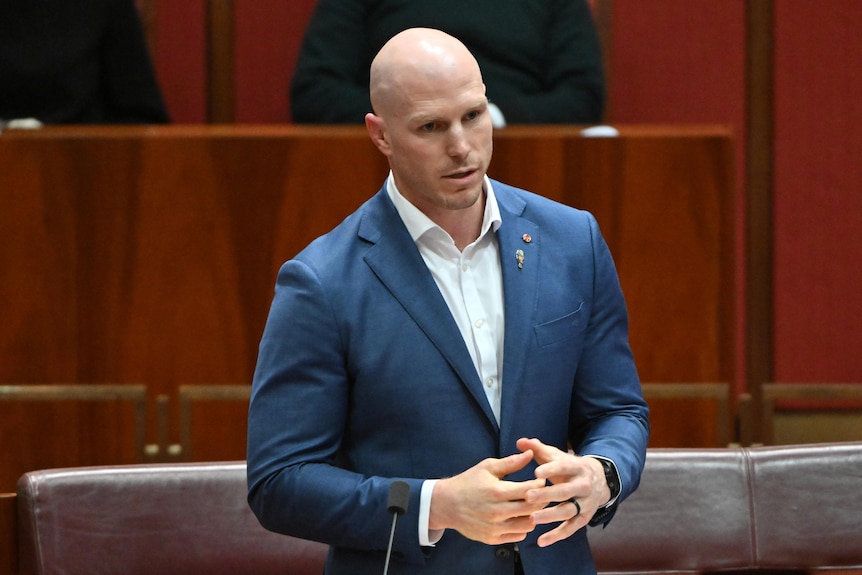 David Pocock speaks on amendments to the Territory Rights Bill in a suit in the ACT Senate chamber