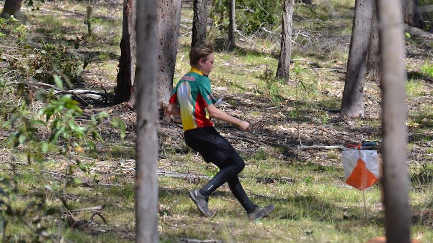 A boy competes in Australian Orienteering Championships