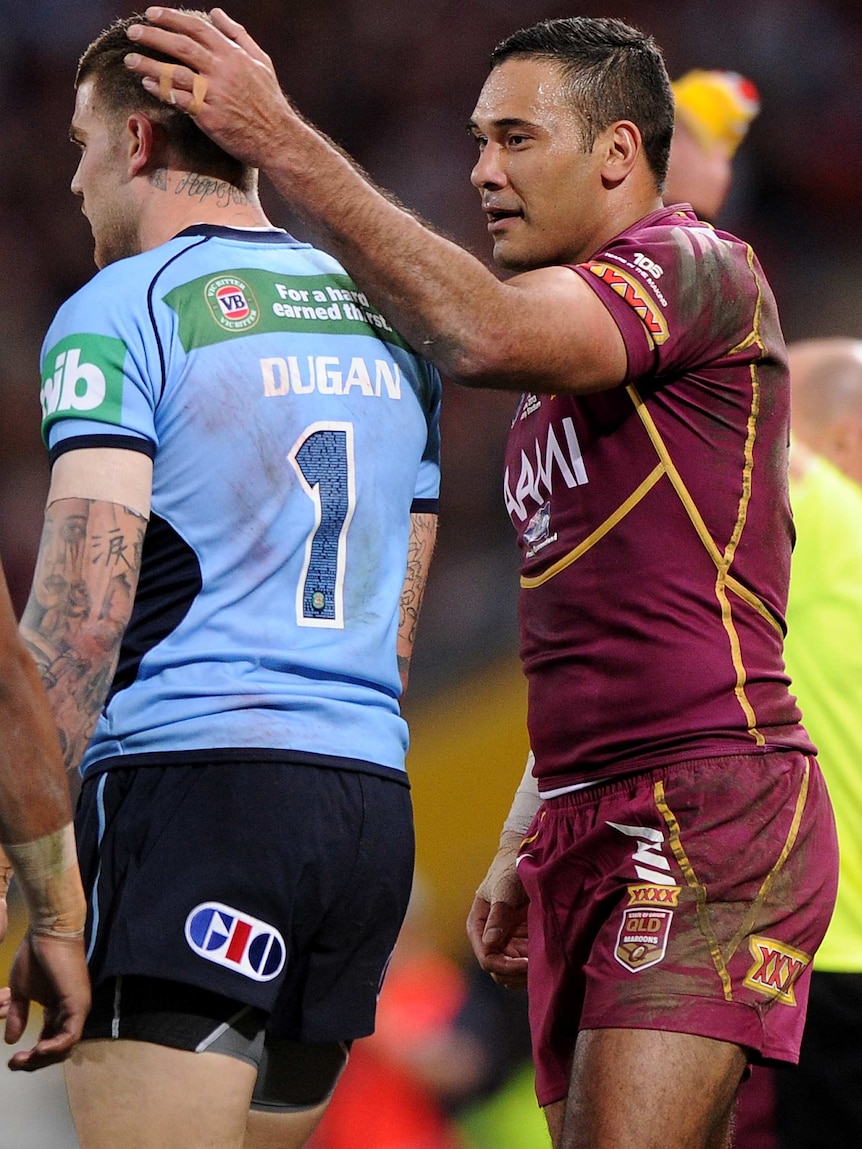 The Maroons' Justin Hodges pats the Blues' Josh Dugan on the head during Origin II, 2013.