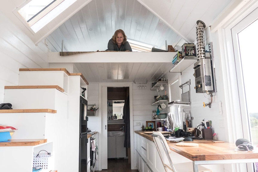 Chris Wenban in her tiny house.