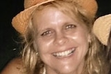 Kerri Pike smiles with a hat on, date unknown