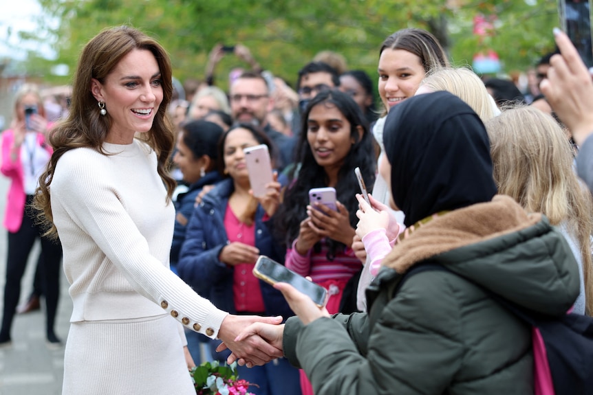 Catherine shakes hands and meets with the public