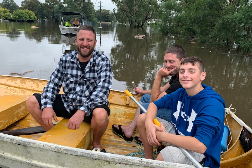 Three men in a boat.