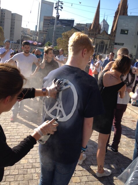 People gather for a vigil for Paris at Federation Square