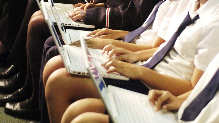 Students work on laptop computers at Arthur Phillip High School at Parramatta in Sydney (AAP: Alan Porritt)
