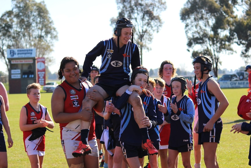 Harley Reid is chaired off the field after kicking his 100th goal of the season for Tongala as a junior in 2019.