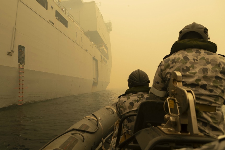 A supplied image shows HMAS Choules' Fast Recovery Craft departing the ship off Mallacoota.