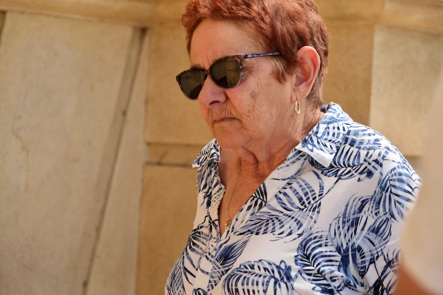 A woman in her sixties wearing sunglasses