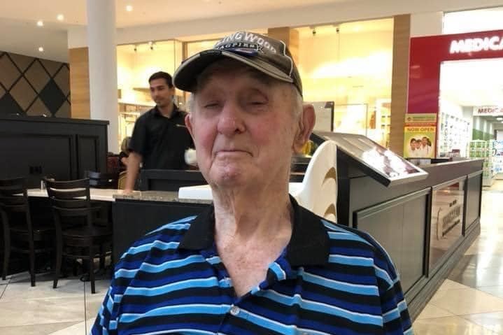 Alf Jordan looks at the camera wearing a striped blue shirt.