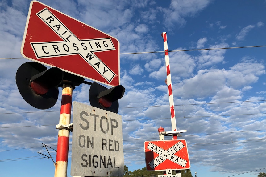 A warning sign at a level rail crossing.