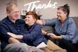 Jacob James sitting on the couch with his dad and mum with the title: Thanks to depict family life when your father has dementia