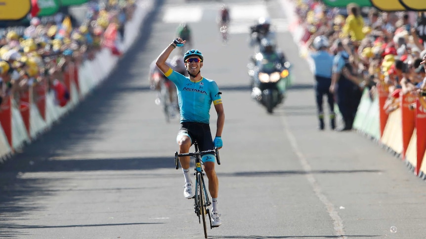 Spain's Omar Fraile Matarranz celebrates as he crosses line to win stage 14 at the Tour de France.