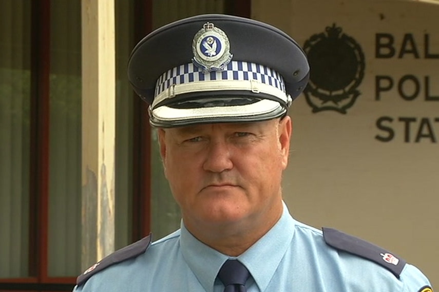 A police officer standing outside Ballina Police Station