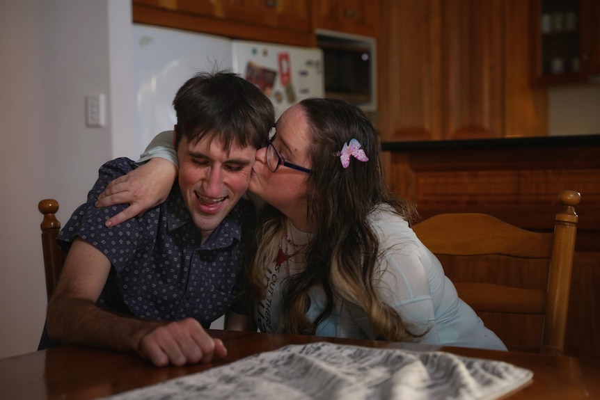 Rebecca Preedy kisses her fiance Mitchel Davidson