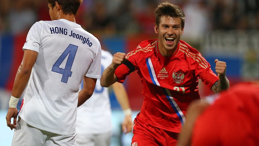 Smolov celebrates goal against South Korea