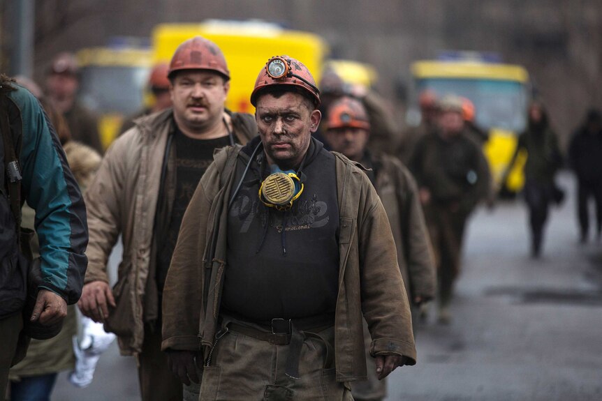 Miners walk out of the Zasyadko coal mine