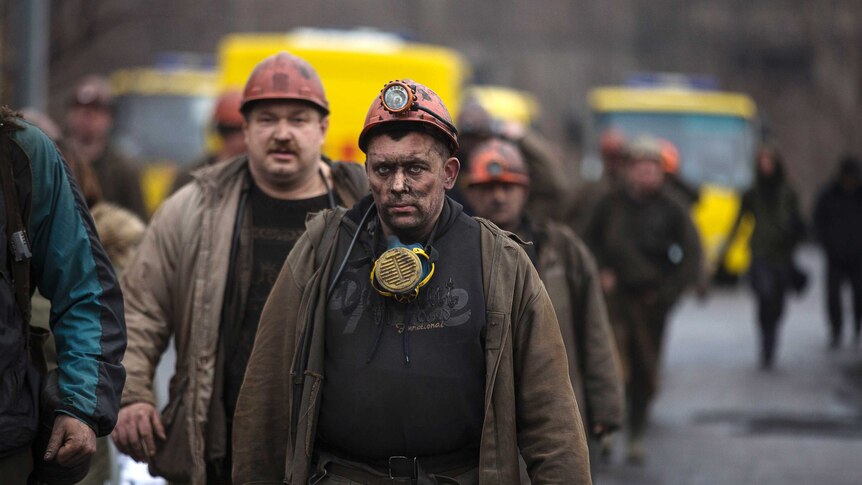 Miners walk out of the Zasyadko coal mine