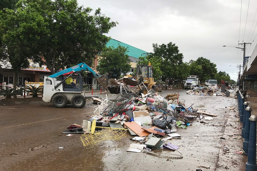 Large piles of rubbish on the road.