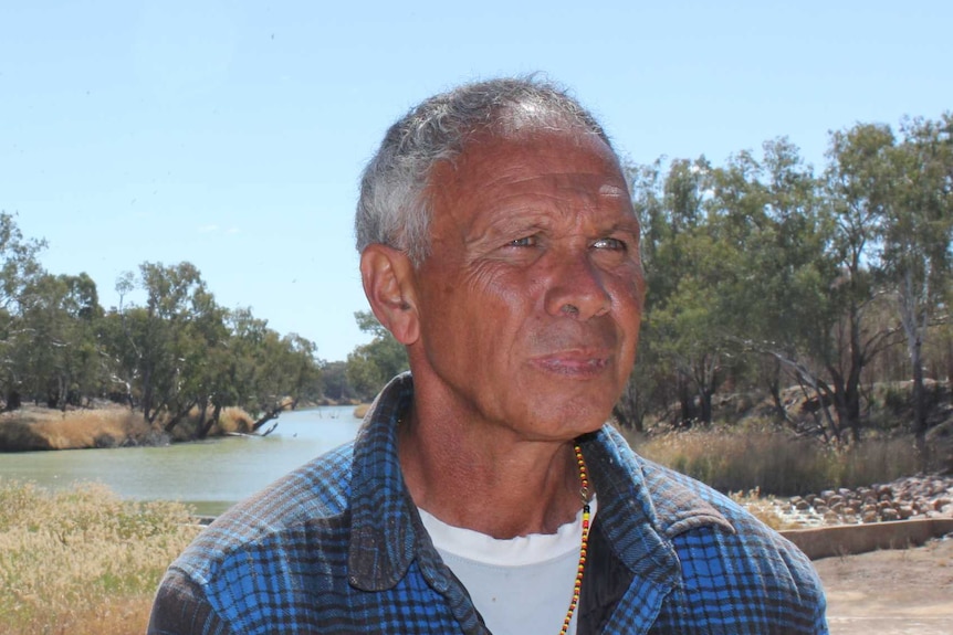 Elected Aboriginal community spokesman Dallas Skuthorpe stands in front of the Barwon River