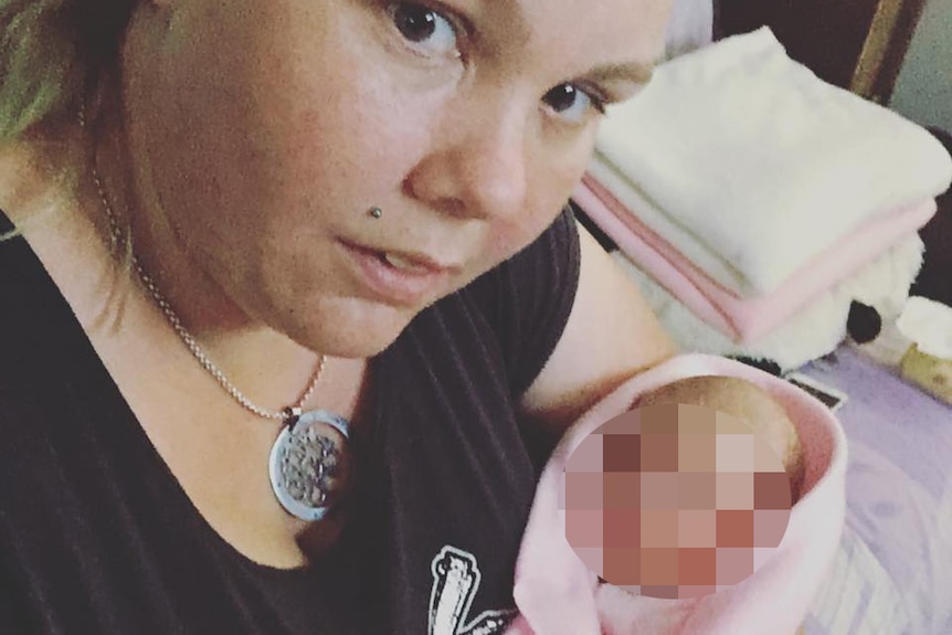 Kandita Kattenberg holding a baby in a photo posted to her Facebook page.