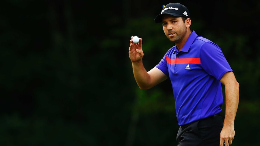 Sergio Garcia holds up his ball after putting for birdie at the second PGA Tour playoff event.