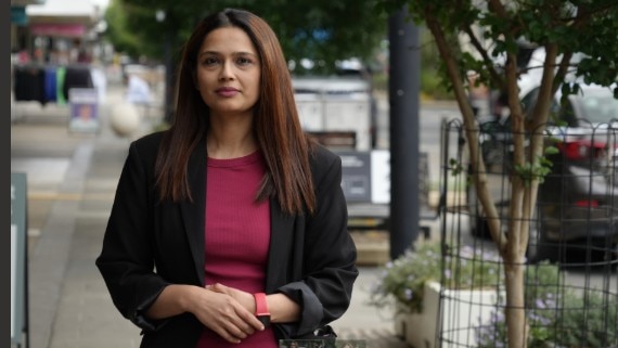 Ethnic Council of Shepparton representative Neha Samar looks towards the camera while standing in the street.