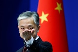 Chinese foreign ministry spokesman Wang Wenbin gestures in a news conference in Beijing.