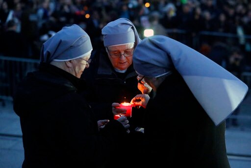 A group of nuns light candles at a vigil for the victims of the terrorist attack in London on 22 March 2017.