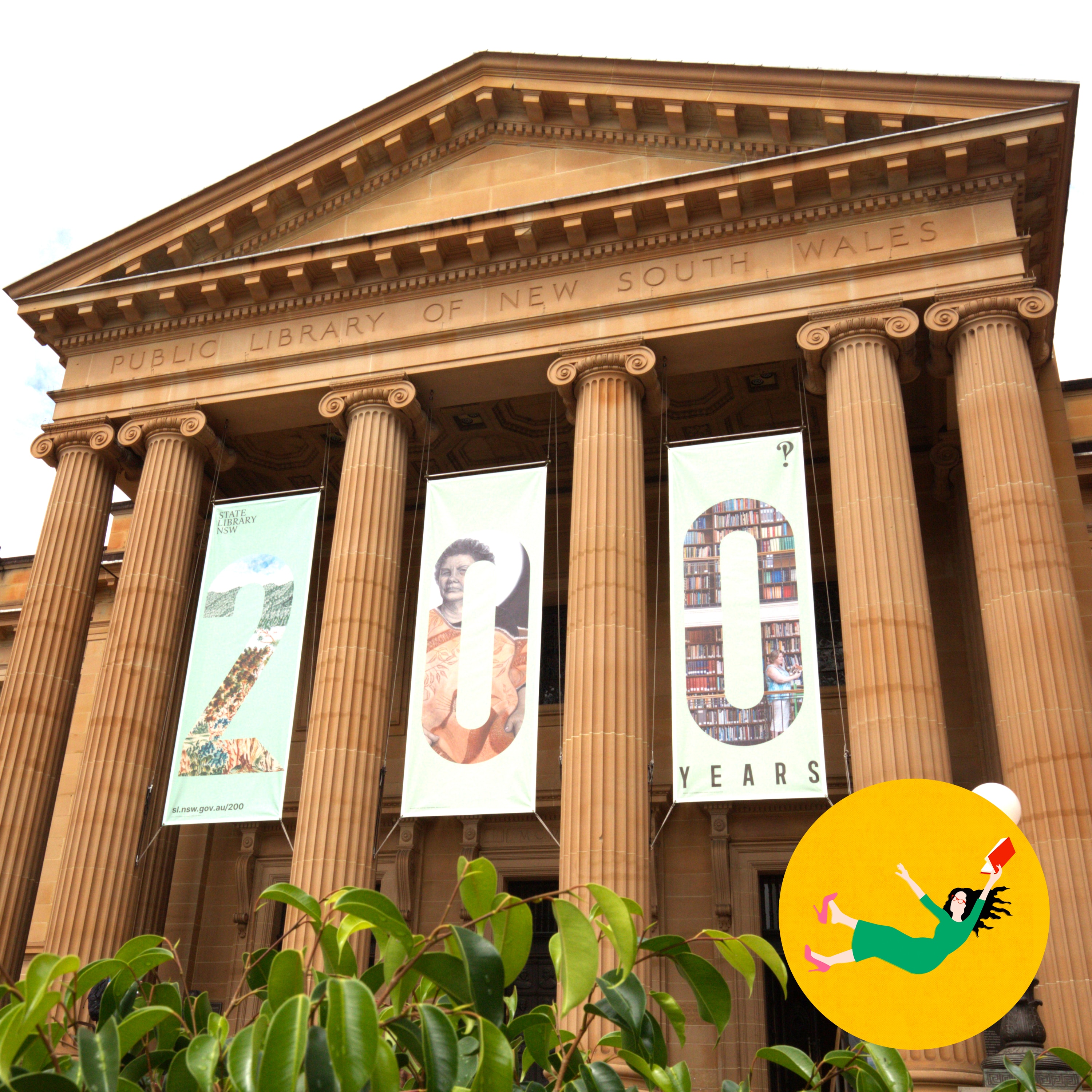 The Public Library of New South Wales, a sandstone building with columns, displaying '200 Years' celebration banners.