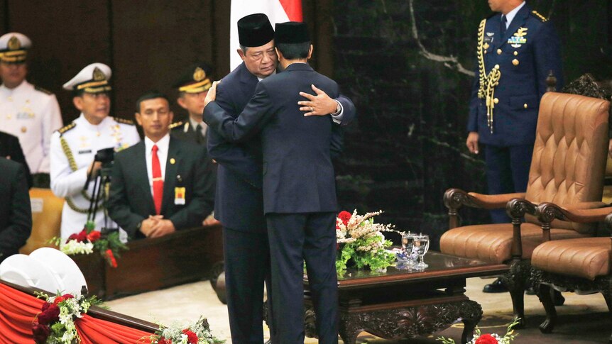 Joko Widodo hugs Susilo Bambang Yudhoyono
