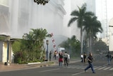 People run following a blast at the Ritz-Carlton Hotel in central Jakarta July 17, 2009.