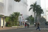 Panic: People run following the blast at the Ritz-Carlton Hotel.