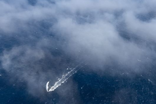An aerial shot of a yacht.