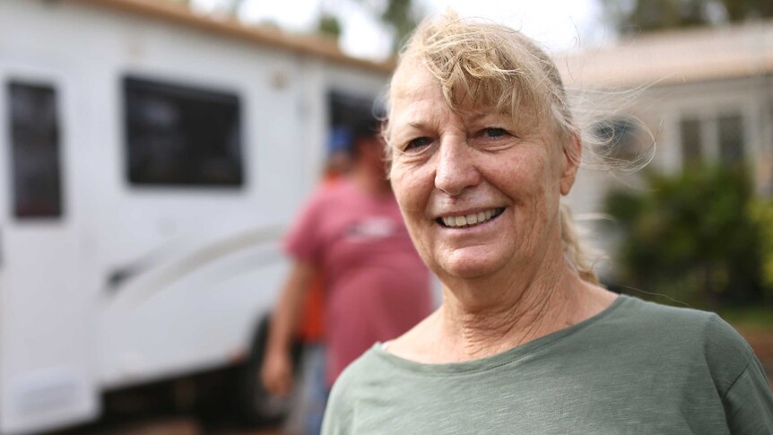 Carol Marinucci standing in front of her caravan.