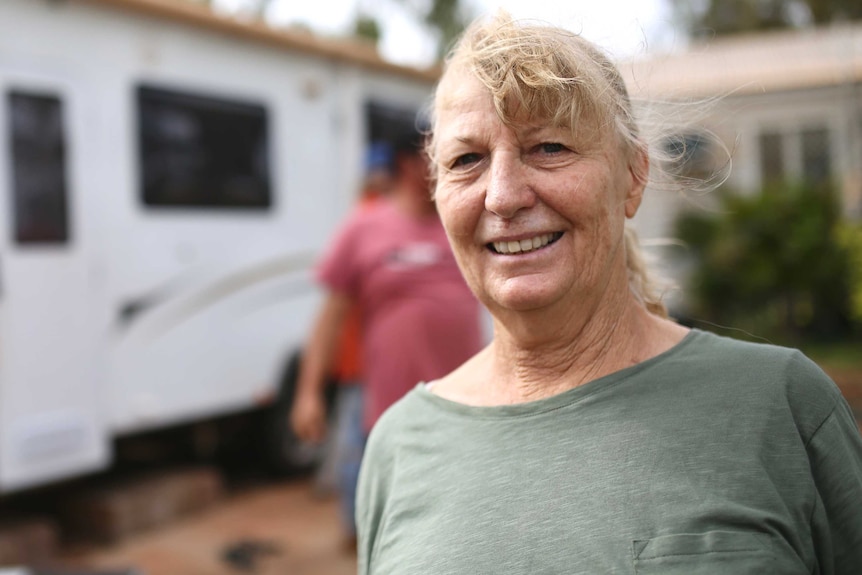 Carol Marinucci standing in front of her caravan.