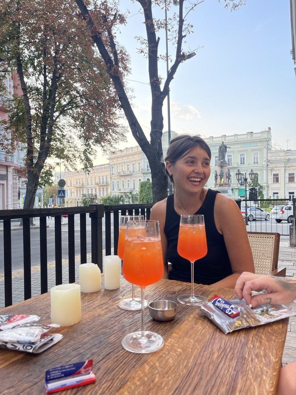 A woman drinks at an Odesa restaurant.