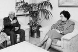 A black and white picture of Walter Sisulu and a woman with WA Premier Carmen Lawrence in a room.