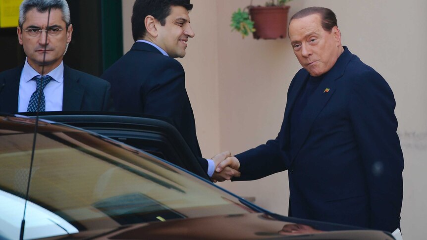 Former Italian PM Silvio Berlusconi arrives for community service