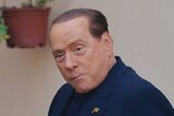 Former Italian PM Silvio Berlusconi arrives for community service