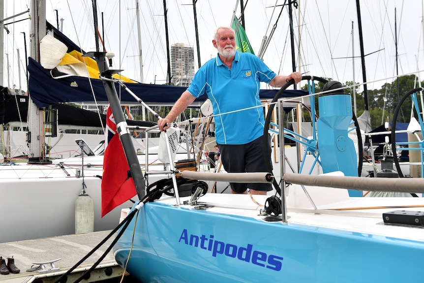 Lindsay May stands on a boat, with the name Antipodes written on it